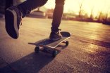 Skateboarder skateboarding at sunrise city Skateboarder skateboarding at sunrise city