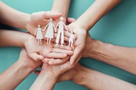 Adult and children hands holding paper family cutout, family home,adoption foster care, homeless charity, family mental health, homeschool education, domestic violence, social distancing, isolation Adult and children hands holding paper family cutout, family home,adoption foster care, homeless charity, family mental health, homeschool education, domestic violence, social distancing, isolation