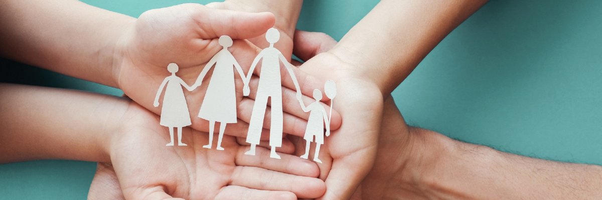Adult and children hands holding paper family cutout, family home,adoption foster care, homeless charity, family mental health,  homeschool education, domestic violence, social distancing, isolation